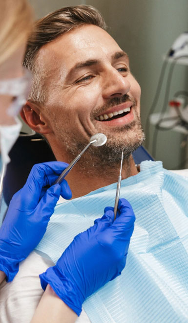 Compton Family Dental man smiling in a dental chair